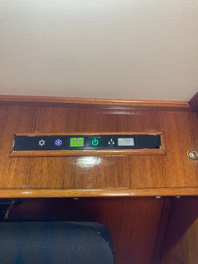 Lolly Yacht Photos Pics Control panel on 1985 Ocean Yachts 55 Super Sport with temperature display and function buttons.