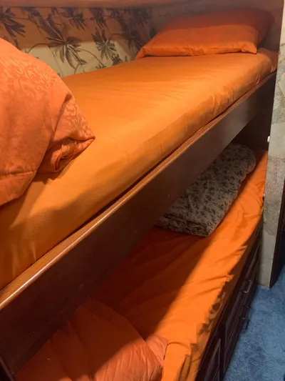 Lolly Yacht Photos Pics Bunk beds with orange bedding in 1985 Ocean Yachts 55 Super Sport.