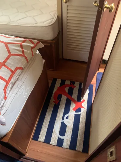 Lolly Yacht Photos Pics Nautical-themed bedroom in a 1985 Ocean Yachts 55 Super Sport boat.