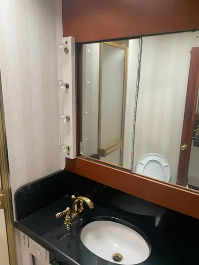 Lolly Yacht Photos Pics 1985 Ocean Yachts 55 Super Sport bathroom with sink and mirror.