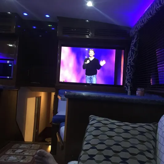 Lolly Yacht Photos Pics Interior of 1985 Ocean Yachts 55 Super Sport with TV and cozy seating area.