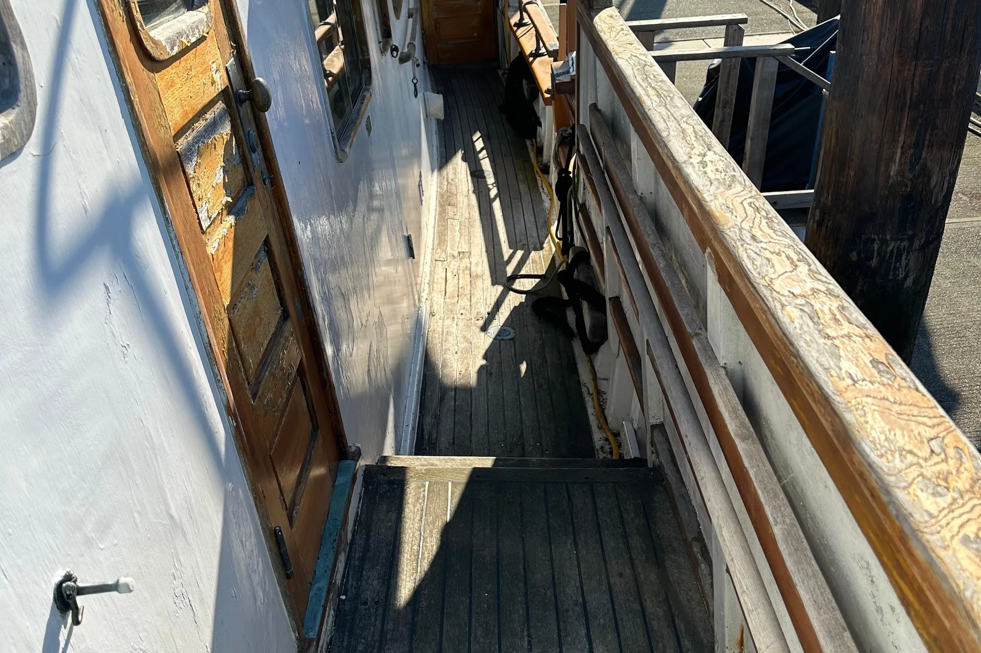 1971 Southern Marine MALAHIDE Pilothouse LRC deck with wooden railings and door.