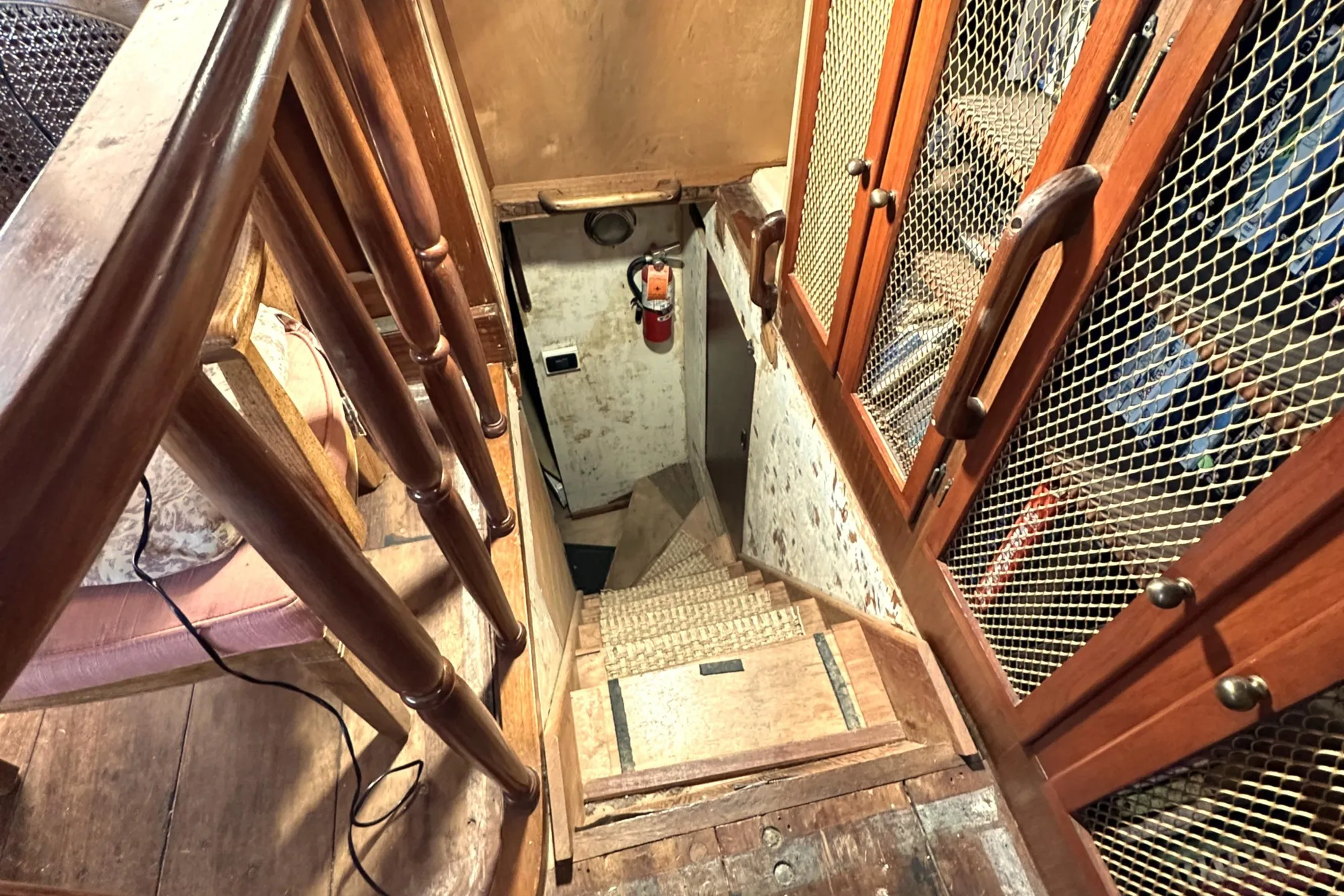 Wooden staircase and cabinets inside 1971 Southern Marine MALAHIDE Pilothouse LRC boat.