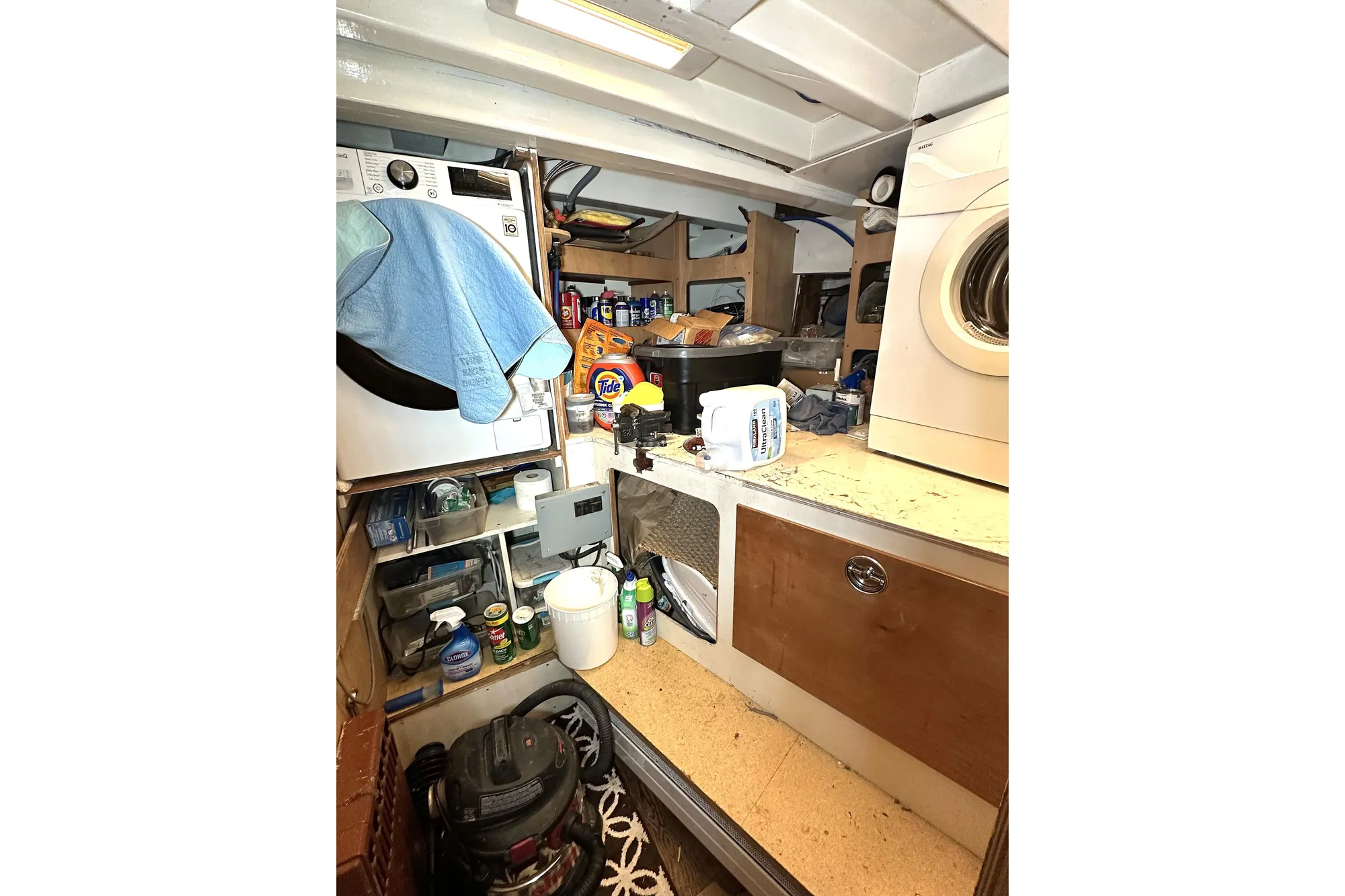 Laundry area inside 1971 Southern Marine MALAHIDE Pilothouse LRC with appliances and storage.