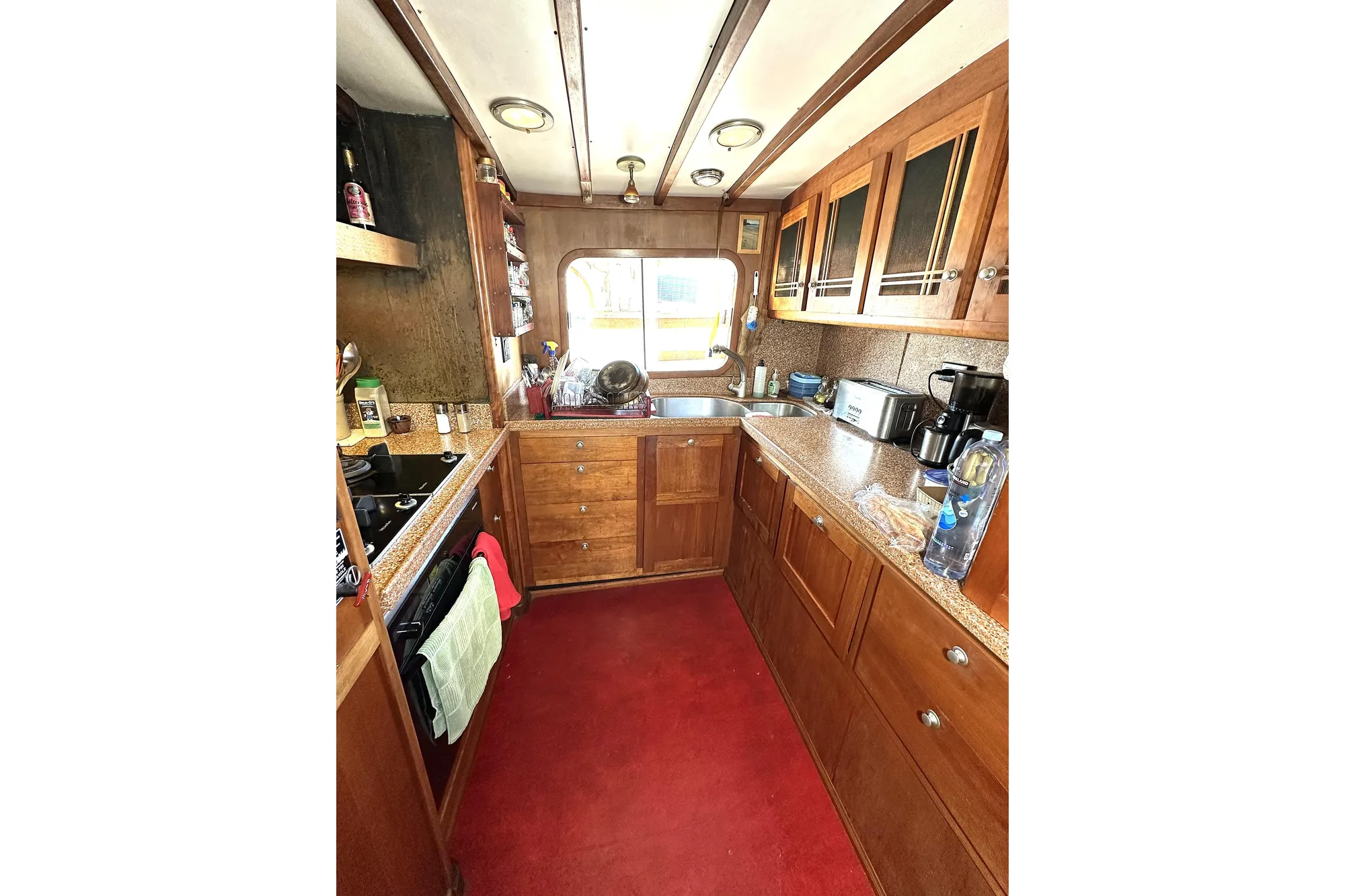 1971 Southern Marine MALAHIDE Pilothouse LRC kitchen with wooden cabinets and modern appliances.