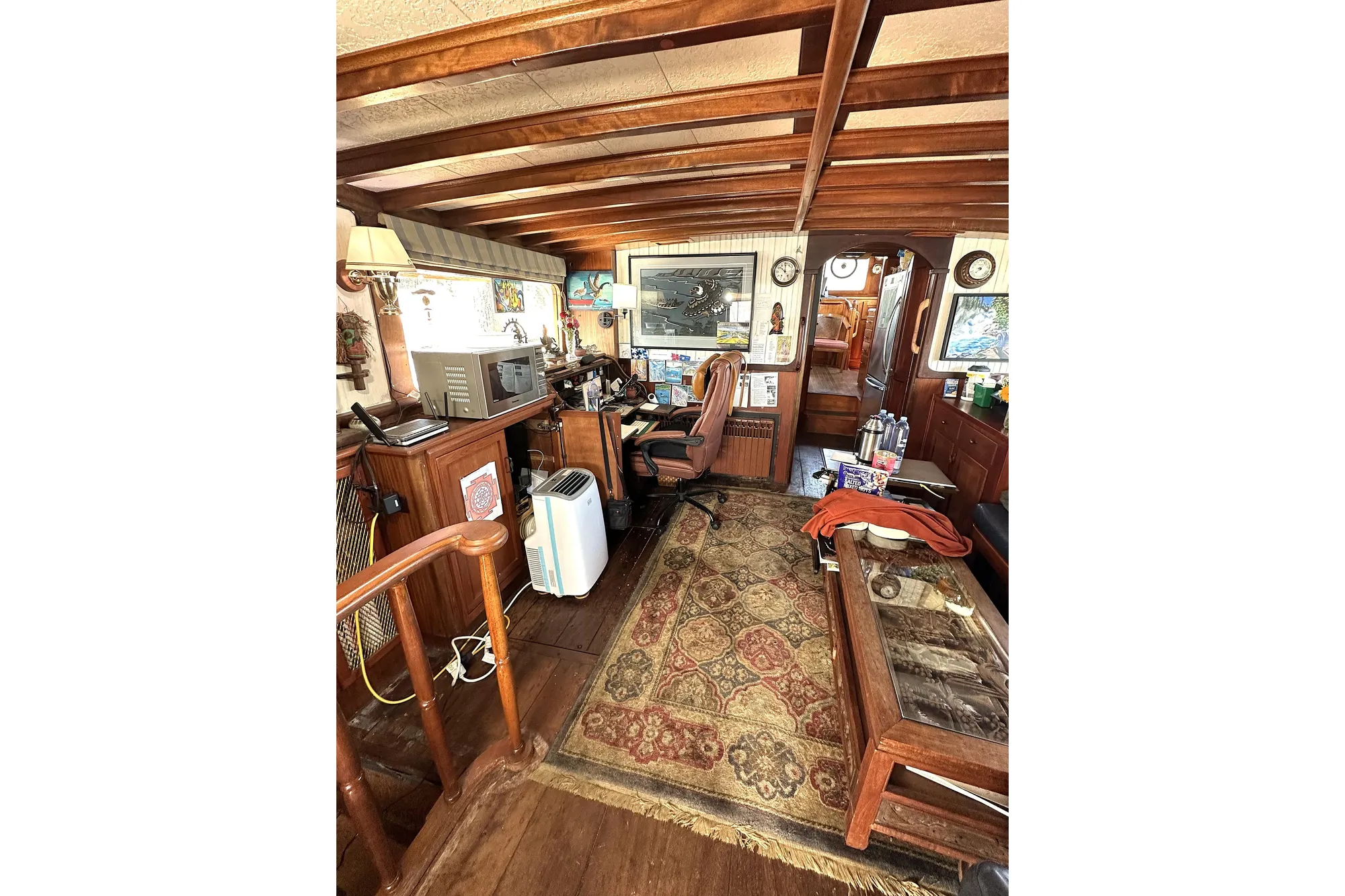 Interior of 1971 Southern Marine MALAHIDE Pilothouse LRC with vintage decor and wooden furnishings.