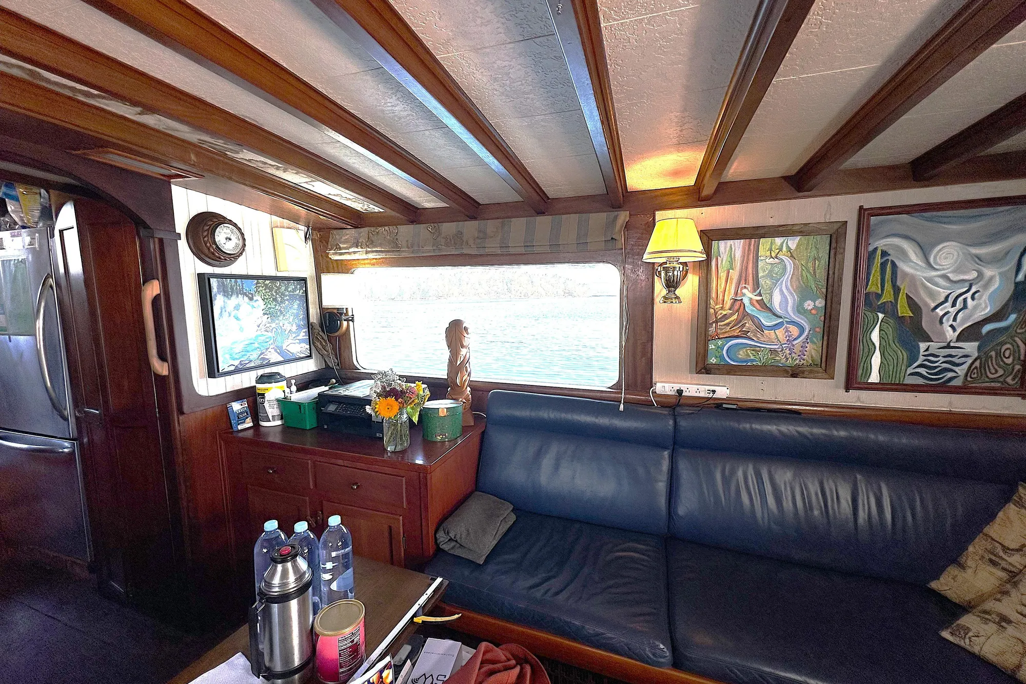 Interior of 1971 Southern Marine MALAHIDE Pilothouse LRC with art, sofa, and nautical decor.