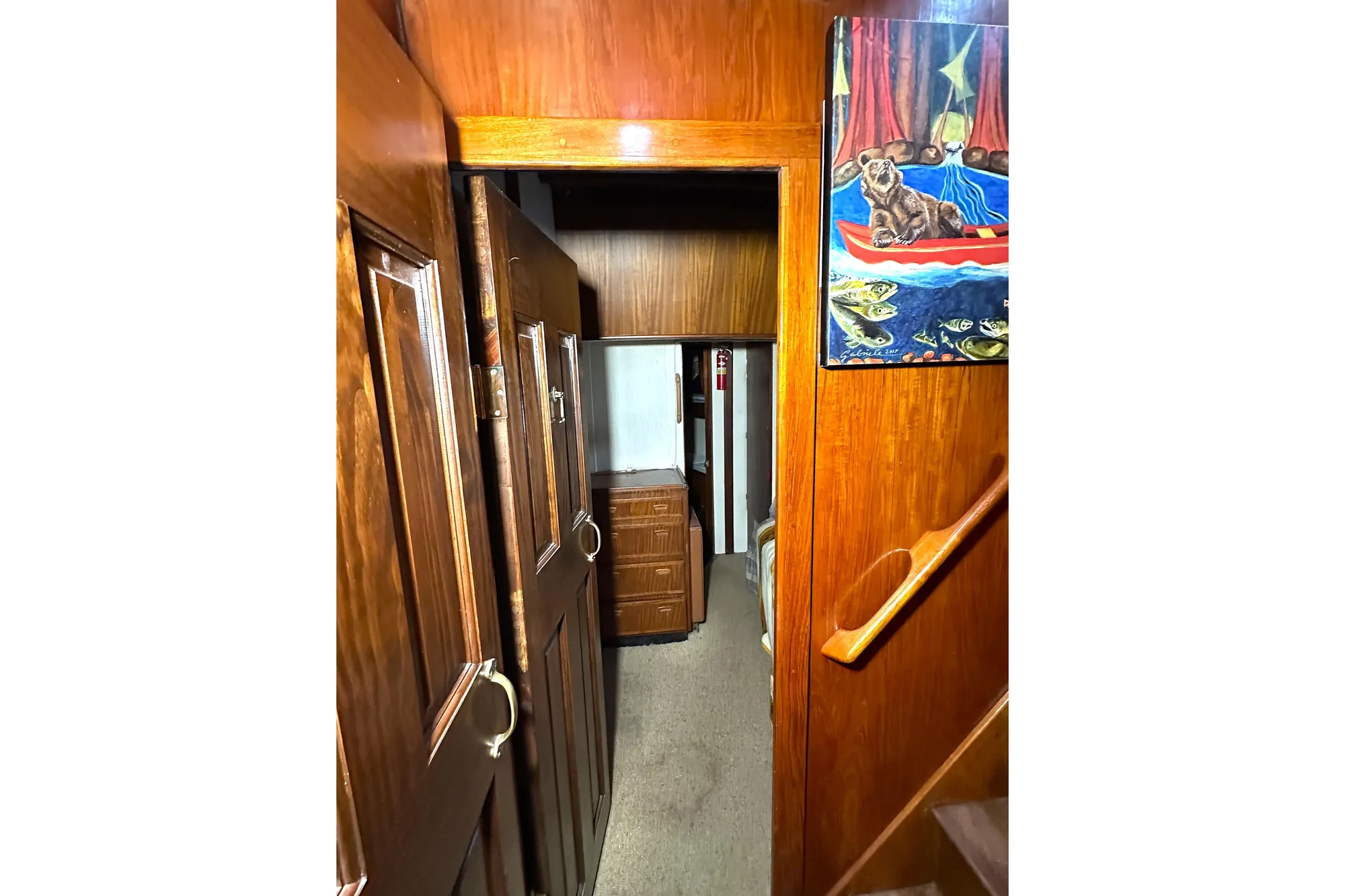 Interior of 1971 Southern Marine MALAHIDE Pilothouse LRC with wooden paneling and artwork.