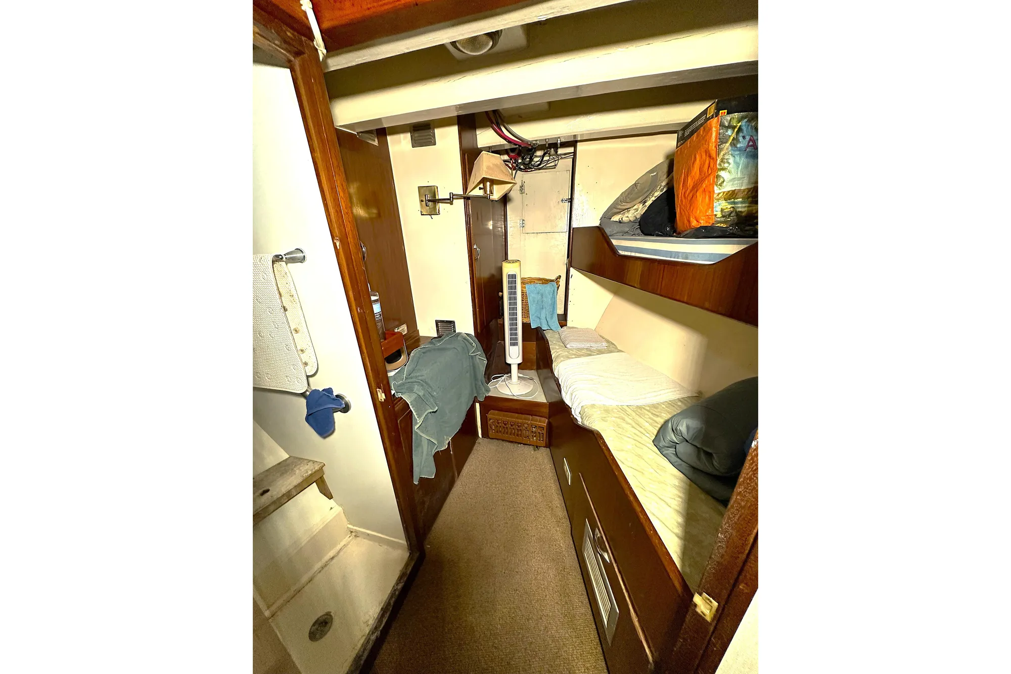 Cozy cabin interior of 1971 Southern Marine MALAHIDE Pilothouse LRC with bunk beds and storage.