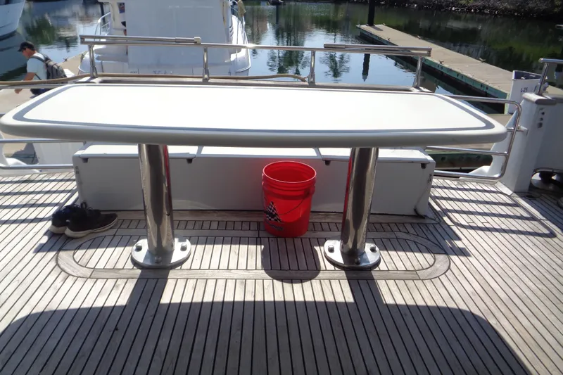 (project Boat) 1995 Azimut 78ultra @ixtapa-mexico Yacht Photos Pics Deck of 1995 Azimut 78 Ultra Motoryacht with table, red bucket, and shoes.