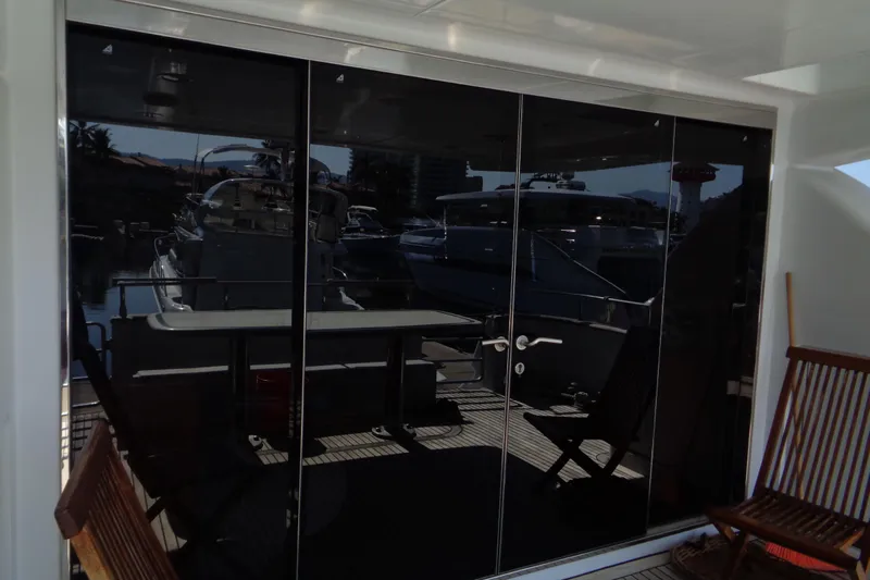 (project Boat) 1995 Azimut 78ultra @ixtapa-mexico Yacht Photos Pics 1995 Azimut 78 Ultra Motoryacht with reflective glass doors and deck chairs.