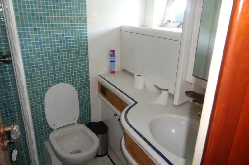 (project Boat) 1995 Azimut 78ultra @ixtapa-mexico Yacht Photos Pics Bathroom interior of 1995 Azimut 78 Ultra Motoryacht with mosaic tiles and modern fixtures.
