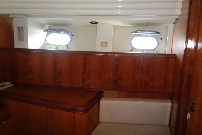 (project Boat) 1995 Azimut 78ultra @ixtapa-mexico Yacht Photos Pics Interior of 1995 Azimut 78 Ultra Motoryacht with wooden cabinetry and porthole windows.