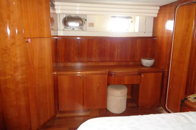 (project Boat) 1995 Azimut 78ultra @ixtapa-mexico Yacht Photos Pics Luxurious wooden interior of 1995 Azimut 78 Ultra Motoryacht cabin with desk and porthole.
