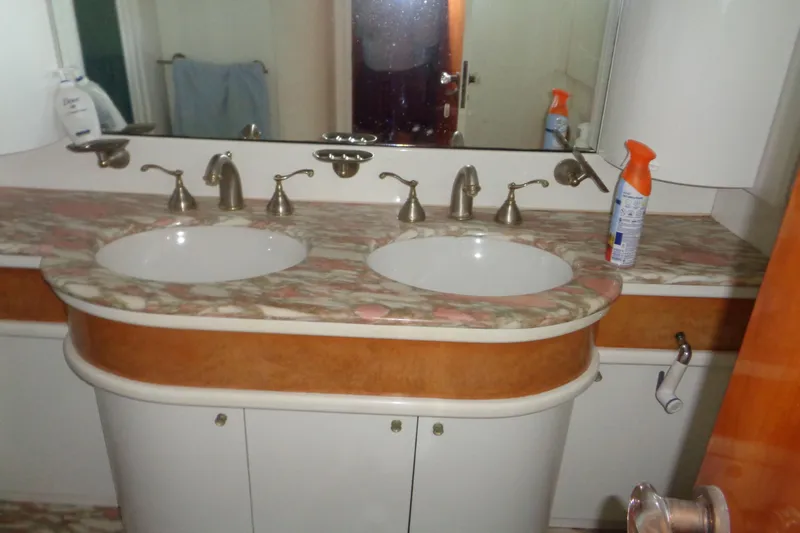 (project Boat) 1995 Azimut 78ultra @ixtapa-mexico Yacht Photos Pics Bathroom vanity with dual sinks on 1995 Azimut 78 Ultra Motoryacht, featuring marble countertop.