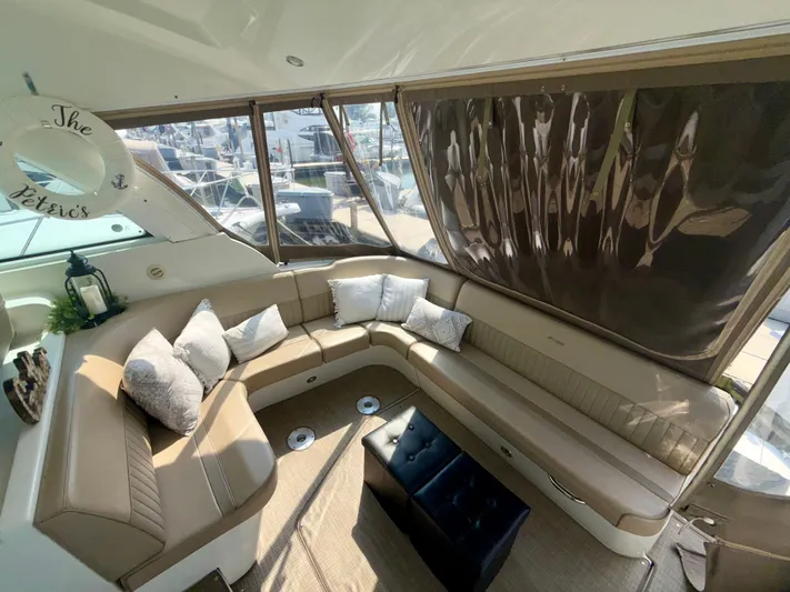  Yacht Photos Pics Luxurious interior of 2009 Cruisers Yachts 420 Coupe with plush seating and elegant decor.