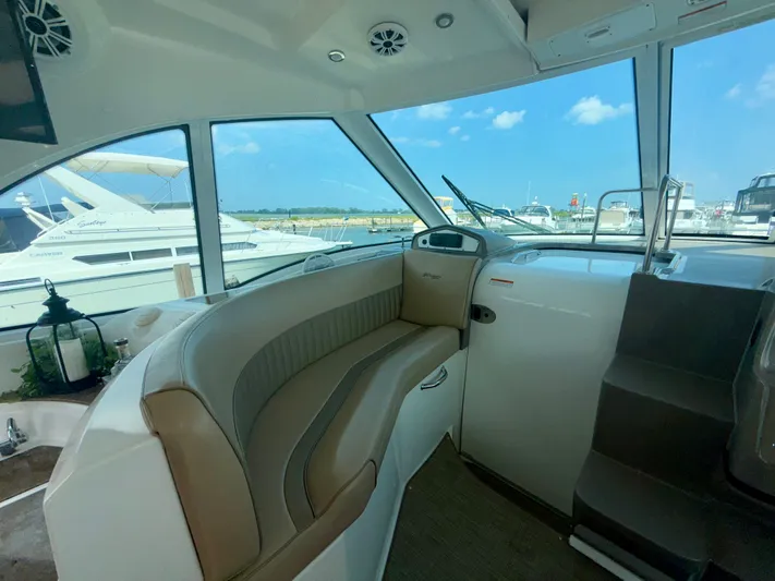  Yacht Photos Pics Interior of a 2009 Cruisers Yachts 420 Coupe with seating and marina view.