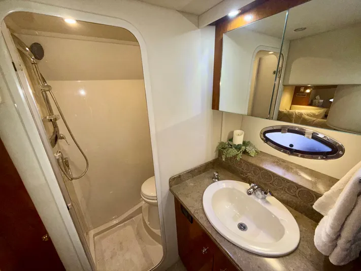  Yacht Photos Pics Luxurious bathroom in 2009 Cruisers Yachts 420 Coupe with shower and sink.