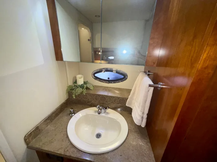  Yacht Photos Pics Luxurious bathroom in 2009 Cruisers Yachts 420 Coupe with elegant sink and mirror.