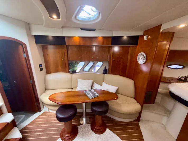  Yacht Photos Pics Luxurious interior of 2009 Cruisers Yachts 420 Coupe with elegant seating and wooden finishes.