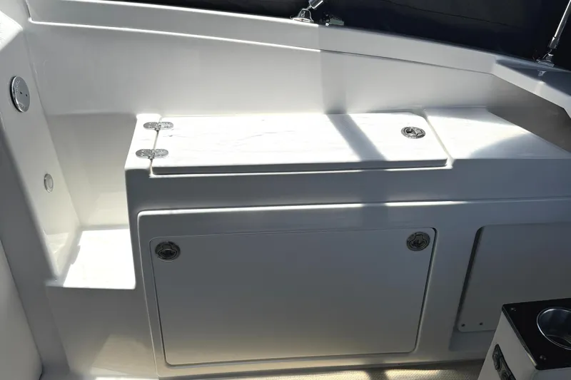  Yacht Photos Pics 2016 Monterey 360 Sport Coupe interior with sleek white cabinetry and storage compartments.