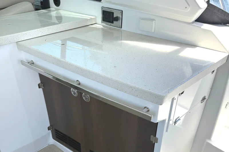  Yacht Photos Pics 2016 Monterey 360 Sport Coupe interior with sleek countertop and storage cabinets.