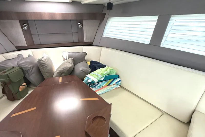  Yacht Photos Pics Interior of 2016 Monterey 360 Sport Coupe with cozy seating and cushions.