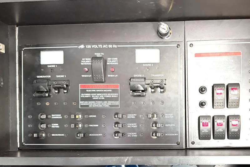  Yacht Photos Pics Control panel of a 2016 Monterey 360 Sport Coupe, featuring various switches and warning labels.
