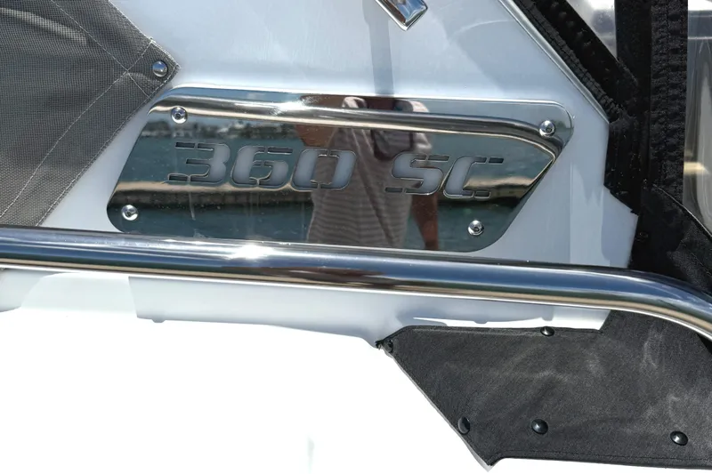  Yacht Photos Pics 2016 Monterey 360 Sport Coupe emblem on a boat, featuring chrome detailing.