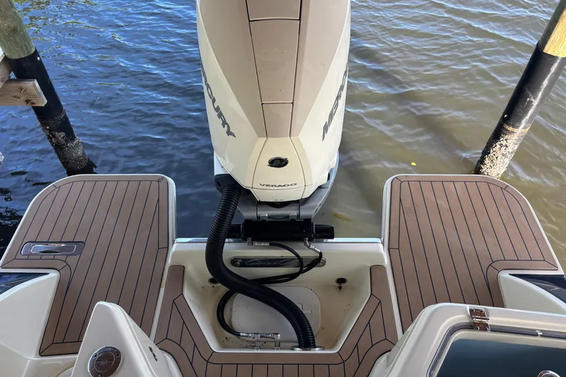  Yacht Photos Pics 2023 Chris-Craft Calypso 24 boat with Mercury outboard engine on water.