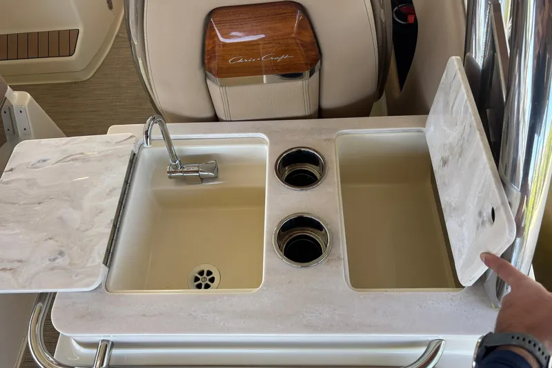  Yacht Photos Pics 2023 Chris-Craft Calypso 24 boat interior with sink and cup holders.