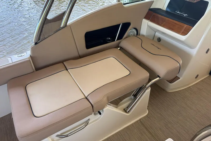  Yacht Photos Pics 2023 Chris-Craft Calypso 24 interior seating with beige upholstery and elegant design.