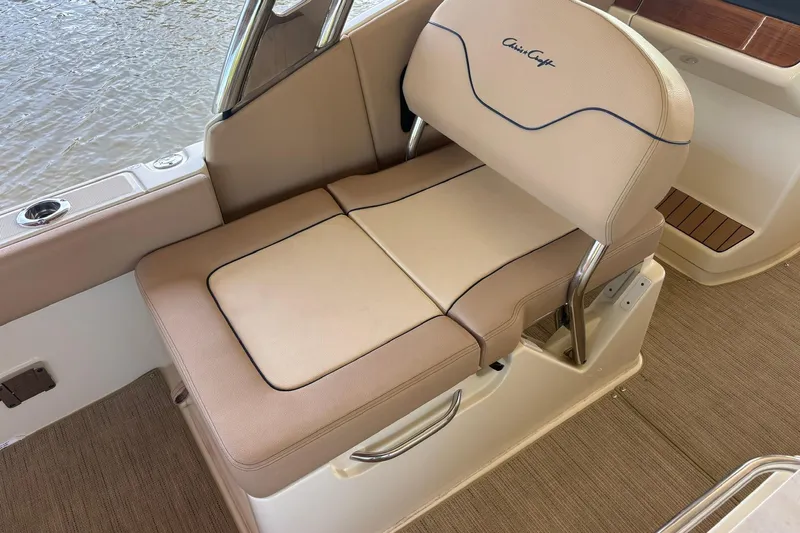  Yacht Photos Pics 2023 Chris-Craft Calypso 24 boat seat with beige upholstery and elegant design.