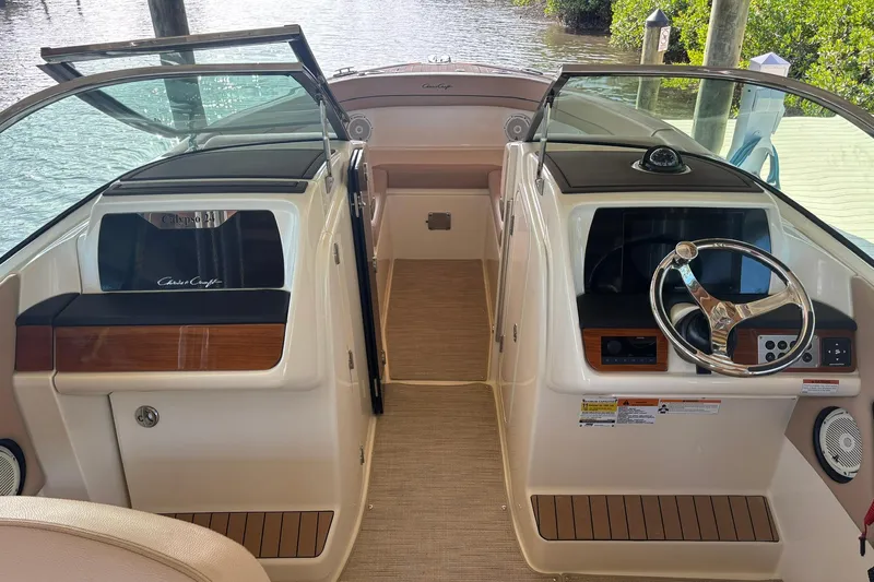  Yacht Photos Pics 2023 Chris-Craft Calypso 24 boat interior with dual consoles and steering wheel.