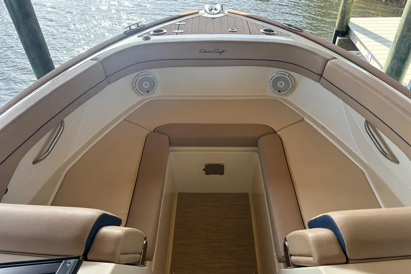  Yacht Photos Pics 2023 Chris-Craft Calypso 24 boat interior with tan seating and speakers.
