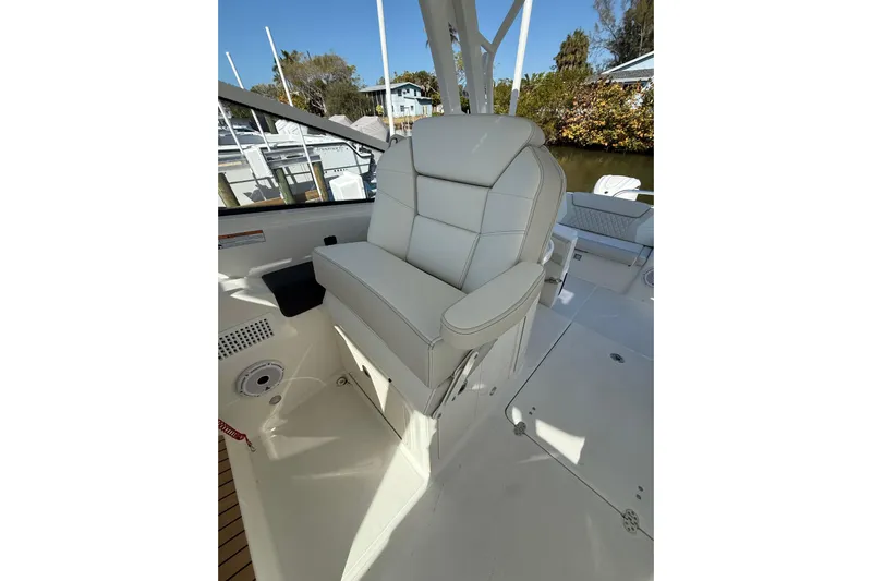 57694 325dc Yacht Photos Pics Luxury seating on 2026 World Cat 325 DC boat, featuring premium white upholstery.