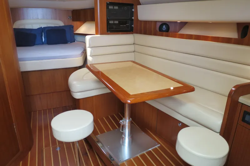 Queen Angela Yacht Photos Pics 2004 Tiara Yachts 3800 Open interior with cozy seating and elegant wood finishes.