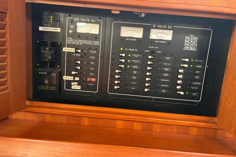 Moondance Yacht Photos Pics Electrical control panel of 2007 Island Packet 370 yacht, featuring AC and DC systems.