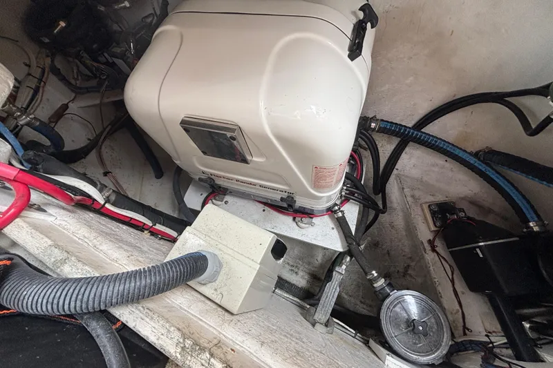 Moondance Yacht Photos Pics Engine compartment of a 2007 Island Packet 370 sailboat, showing mechanical components and wiring.