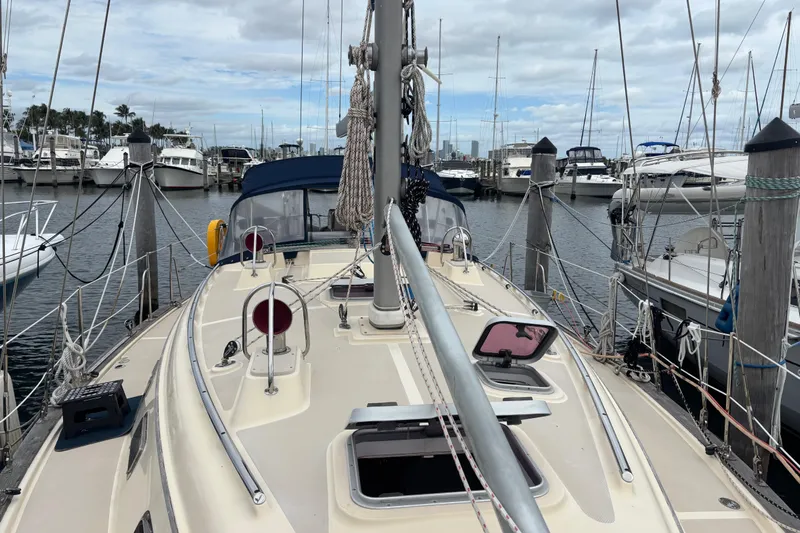 Moondance Yacht Photos Pics 2007 Island Packet 370 sailboat docked at marina with overcast sky.