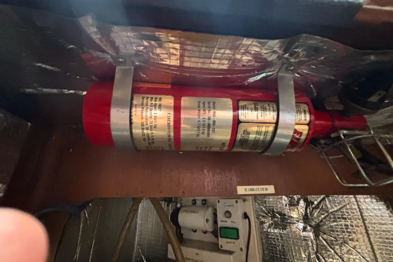 Moondance Yacht Photos Pics Fire extinguisher mounted on 2007 Island Packet 370 yacht interior.