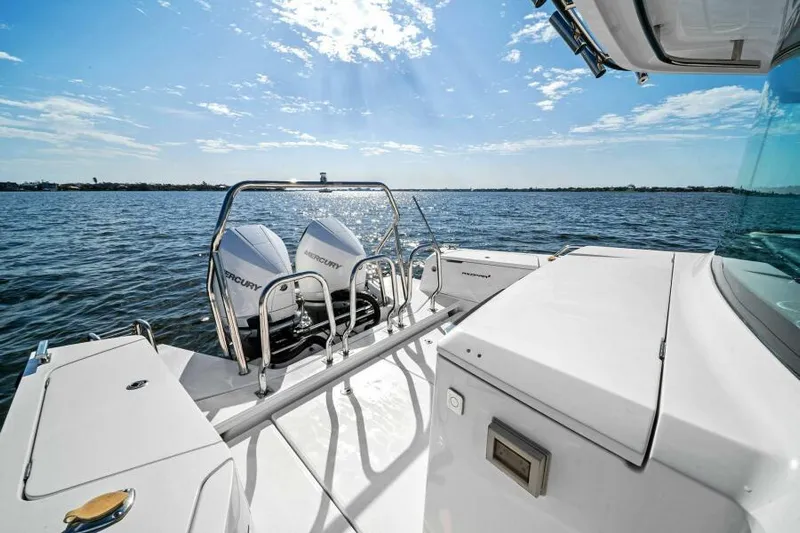  Yacht Photos Pics 2022 Axopar 37 Cross Cabin boat with dual Mercury engines on open water.