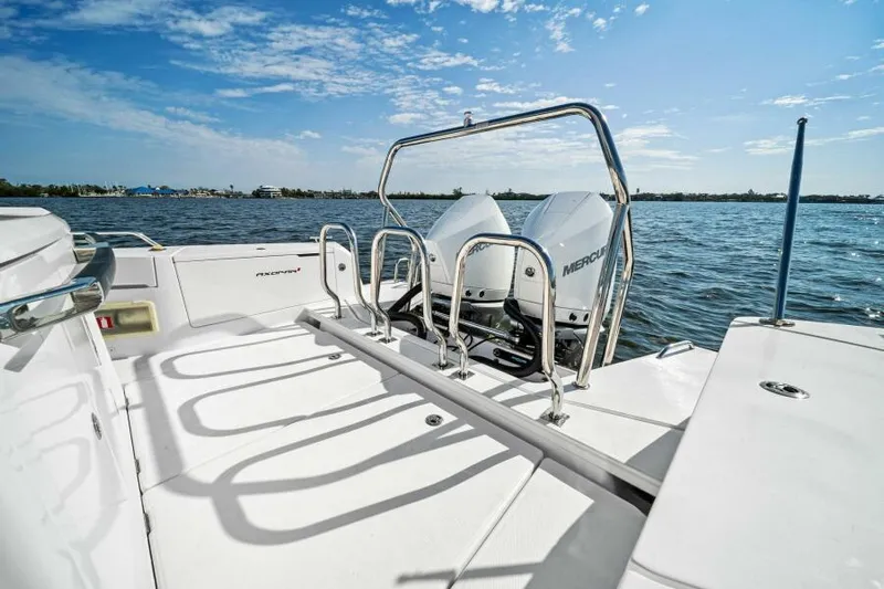  Yacht Photos Pics 2022 Axopar 37 Cross Cabin boat with dual Mercury engines on a sunny day.