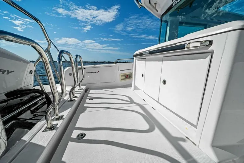  Yacht Photos Pics 2022 Axopar 37 Cross Cabin boat deck with sleek design and ocean view.