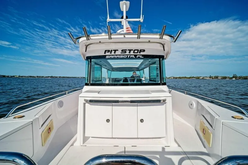  Yacht Photos Pics 2022 Axopar 37 Cross Cabin boat on water, labeled "Pit Stop," Sarasota, FL.