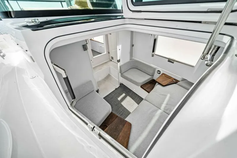  Yacht Photos Pics 2022 Axopar 37 Cross Cabin interior with modern seating and sleek design.