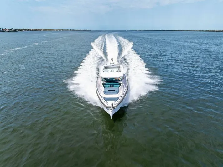  Yacht Photos Pics 2022 Axopar 37 Cross Cabin cruising on open water, aerial view.