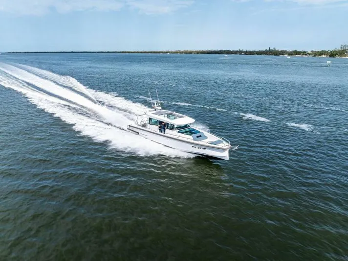  Yacht Photos Pics 2022 Axopar 37 Cross Cabin cruising on open water.