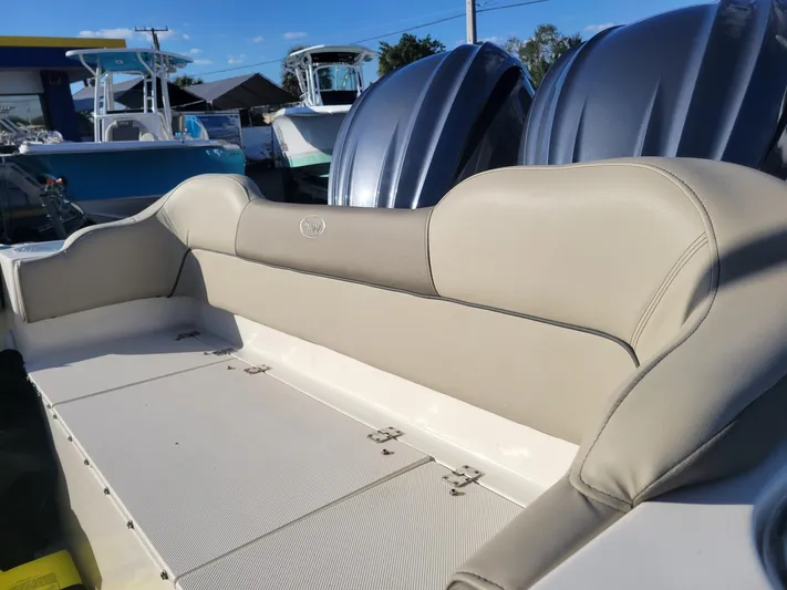  Yacht Photos Pics 2022 Key West 263 FS boat interior with beige seating and dual engines.