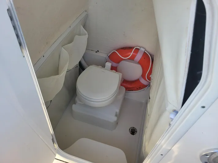  Yacht Photos Pics 2022 Key West 263 FS boat interior with toilet and life preserver.